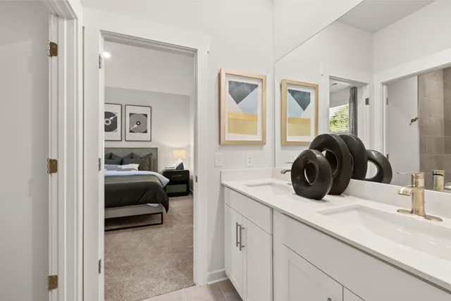 a bathroom with a shower and a glass door