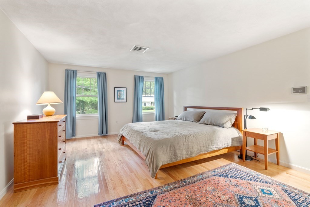 45 Upson Road Wellesley, MA 02482 - Photo 14 of 37 a bedroom with a bed and wooden floor
