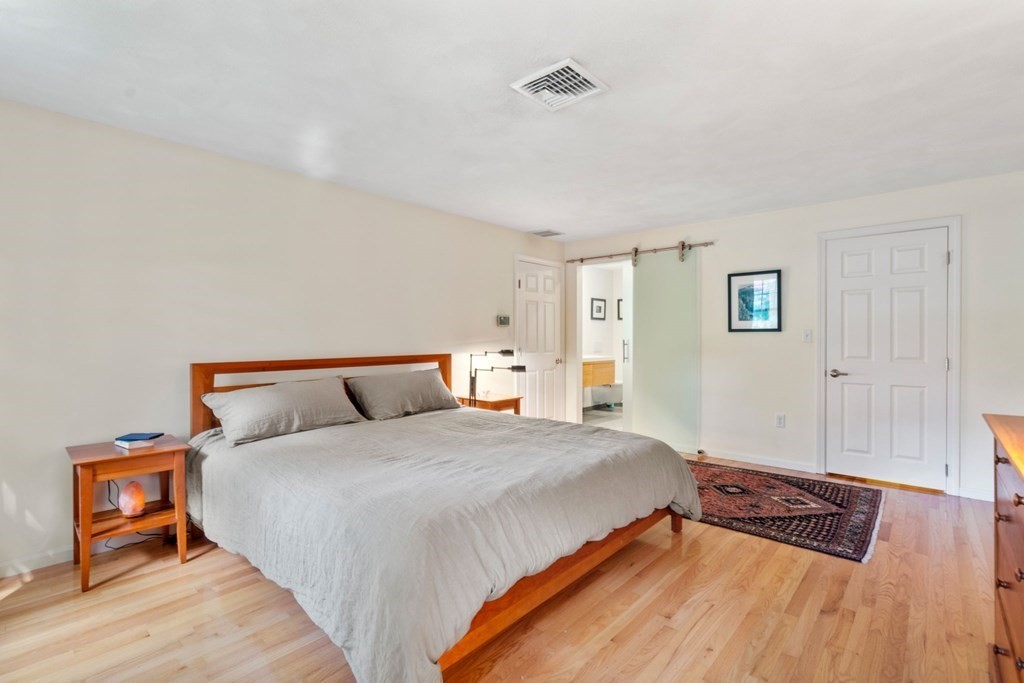 45 Upson Road Wellesley, MA 02482 - Photo 15 of 37 a bedroom with bed and wooden floor