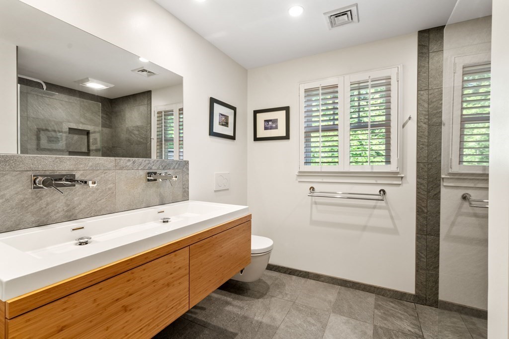 45 Upson Road Wellesley, MA 02482 - Photo 17 of 37 a bathroom with a tub sink and mirror