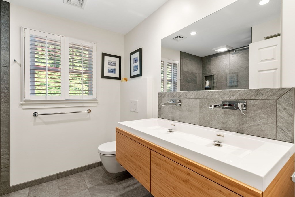 45 Upson Road Wellesley, MA 02482 - Photo 22 of 37 a bathroom with a tub sink toilet and mirror
