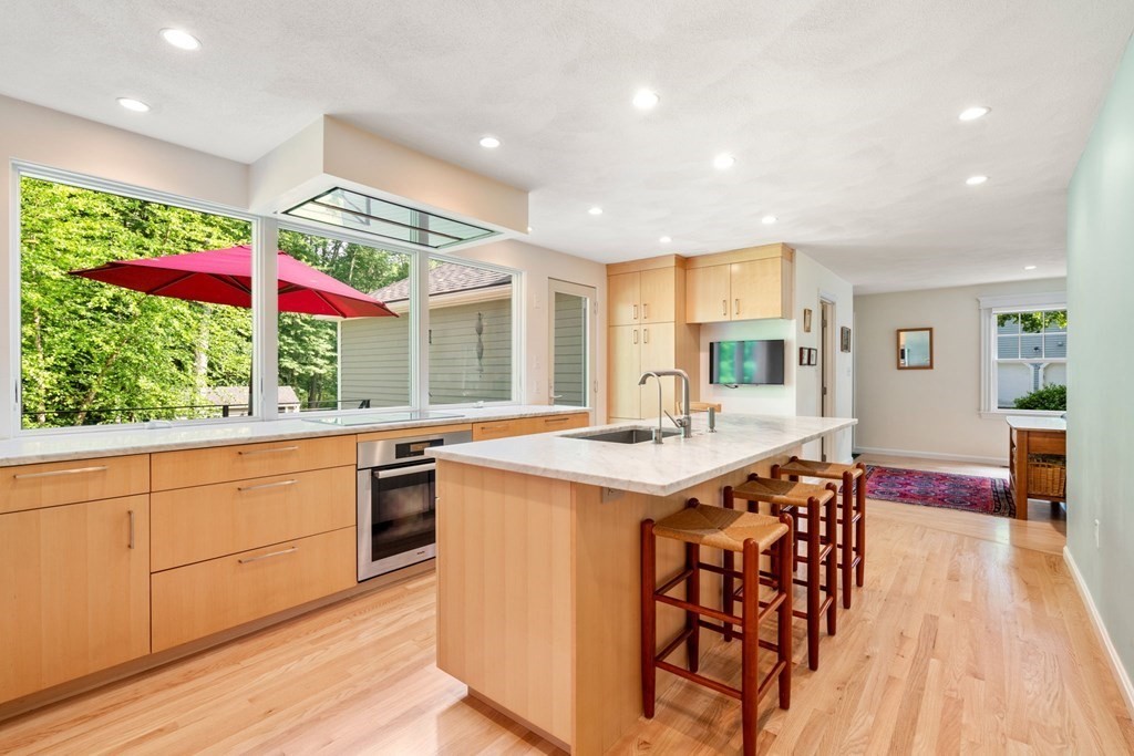 45 Upson Road Wellesley, MA 02482 - Photo 4 of 37 a kitchen with stainless steel appliances granite countertop a stove and a wooden floors