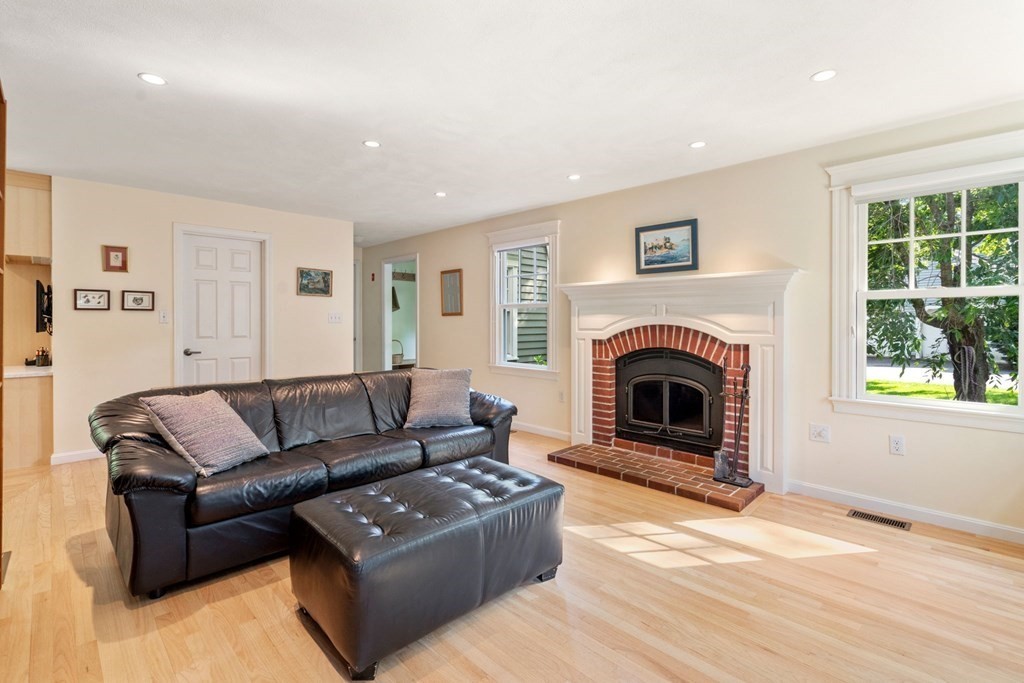 45 Upson Road Wellesley, MA 02482 - Photo 8 of 37 a living room with furniture and a fireplace