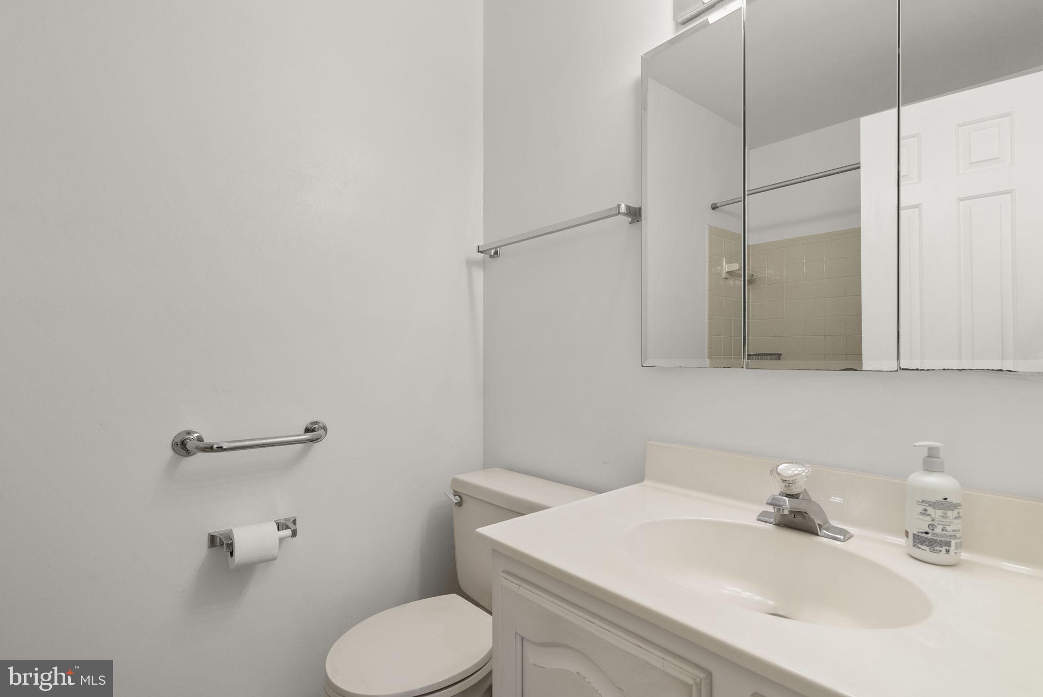 4404 Rendale Court Olney, MD 20832 - Photo 15 of 32 a bathroom with a sink toilet and shower