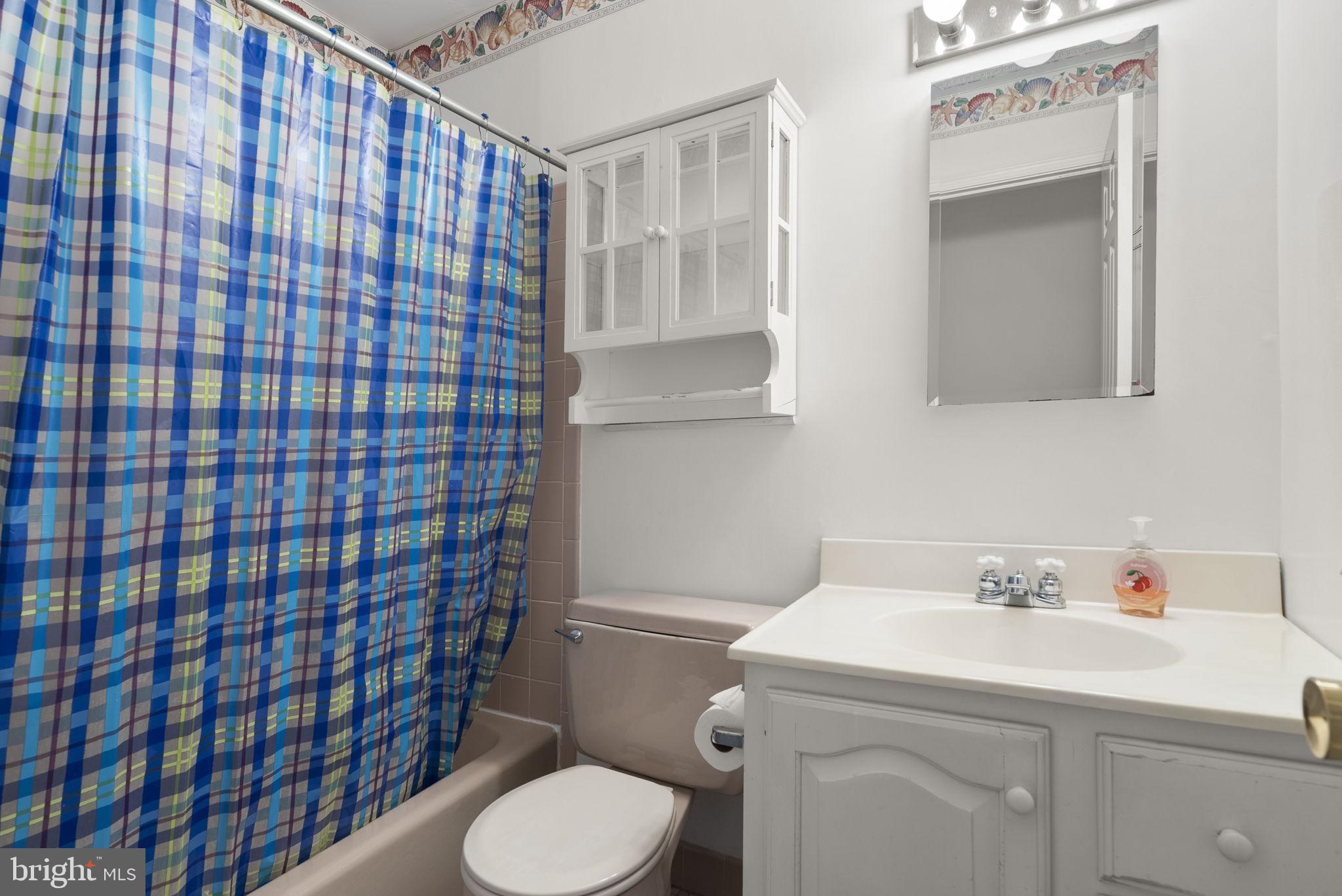 4404 Rendale Court Olney, MD 20832 - Photo 22 of 32 a bathroom with a sink toilet and shower