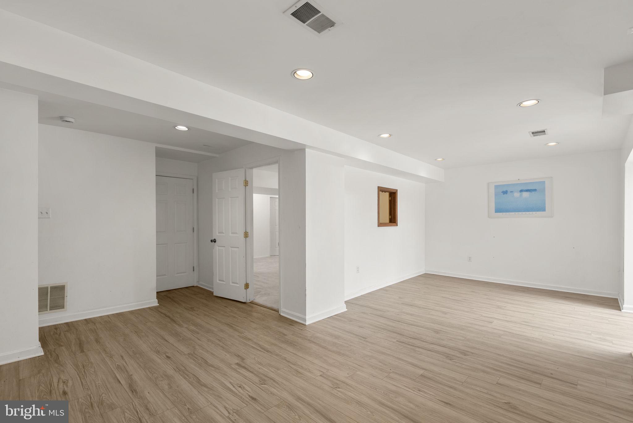 4404 Rendale Court Olney, MD 20832 - Photo 24 of 32 a view of an empty room with wooden floor