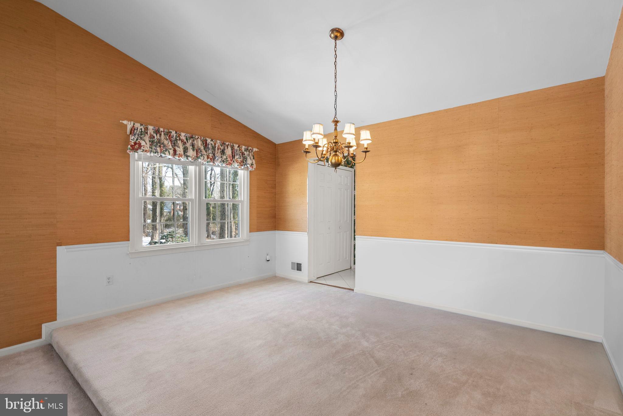 4404 Rendale Court Olney, MD 20832 - Photo 7 of 32 a view of an empty room with chandelier