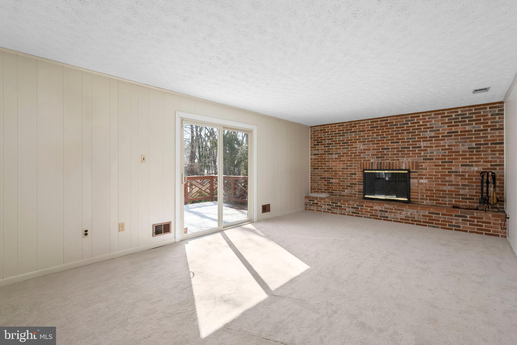 4404 Rendale Court Olney, MD 20832 - Photo 8 of 32 a view of an empty room with a fireplace