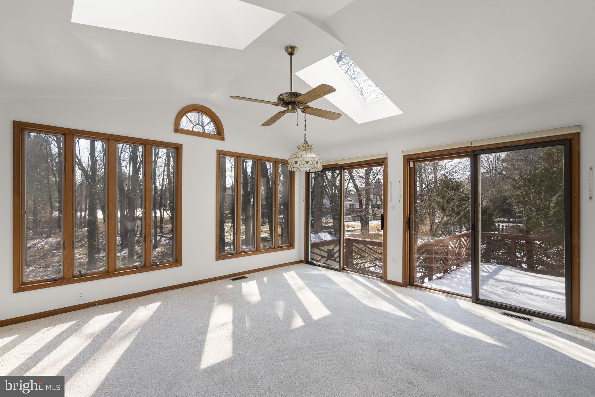 4404 Rendale Court Olney, MD 20832 - Photo 10 of 32 a view of a room with window ceiling fan and front door