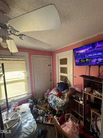 a bedroom with bed and a window