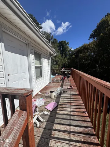 a view of balcony and wooden floor