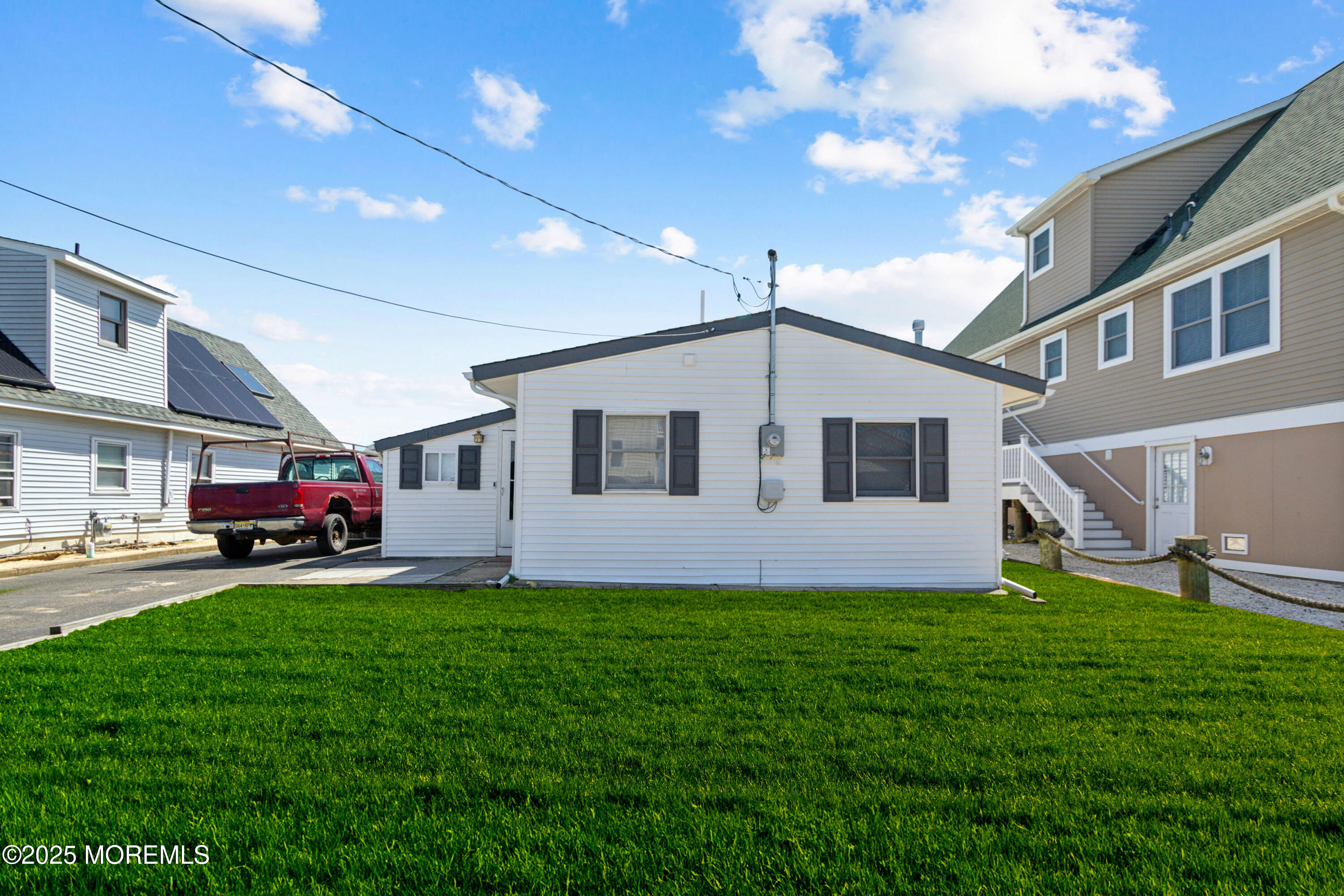 131 South Commodore Drive Little Egg Harbor, NJ 08087 - Photo 2 of 25 a house view with a sitting space and garden