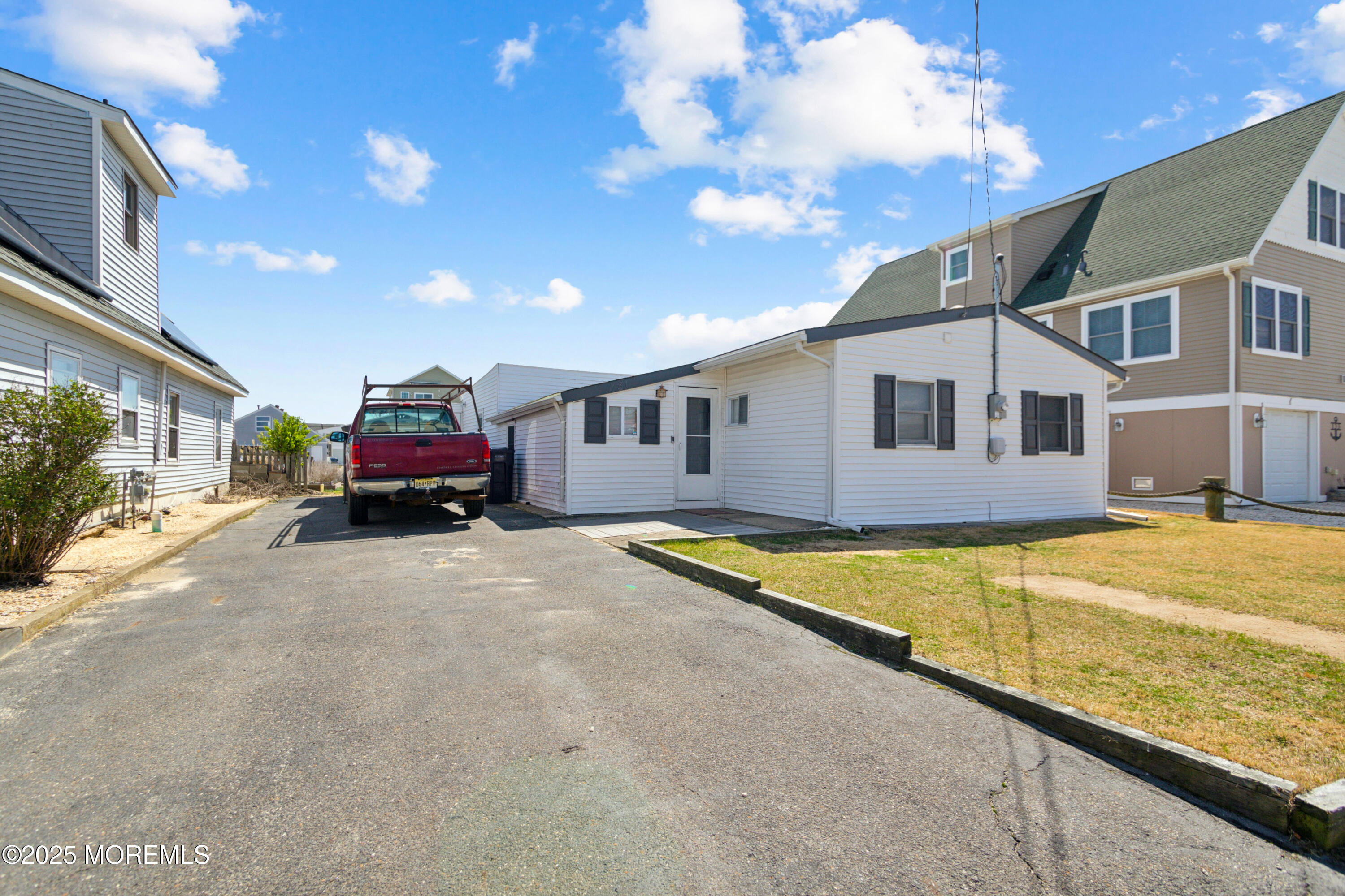 131 South Commodore Drive Little Egg Harbor, NJ 08087 - Photo 3 of 25 a swimming pool with outdoor seating and yard