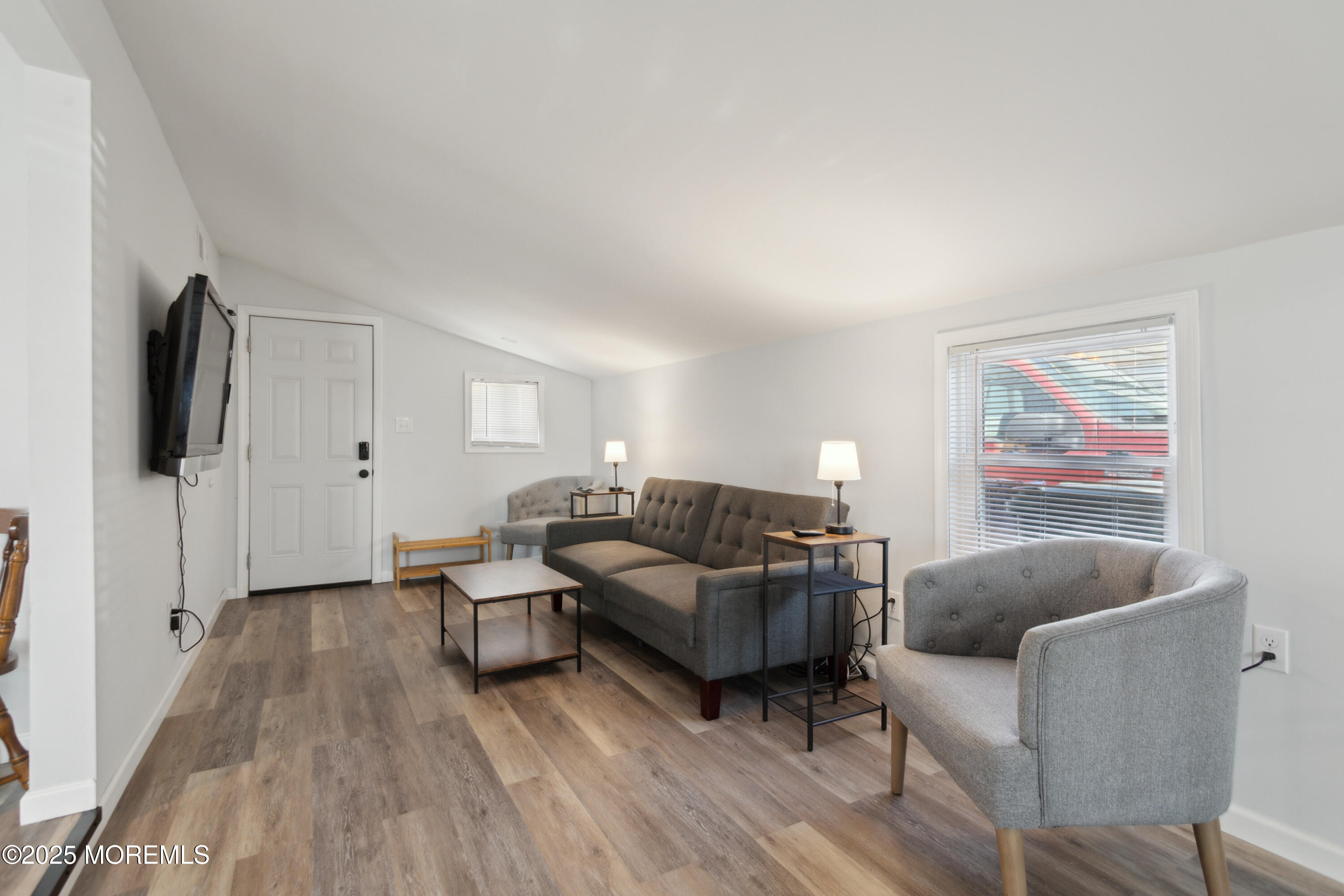 131 South Commodore Drive Little Egg Harbor, NJ 08087 - Photo 4 of 25 a living room with furniture and a flat screen tv