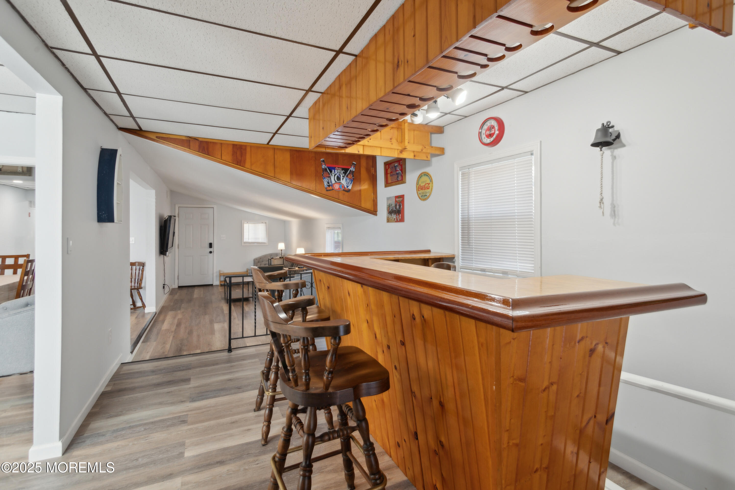131 South Commodore Drive Little Egg Harbor, NJ 08087 - Photo 7 of 25 a view of a patio with table and chairs with wooden floor and fence