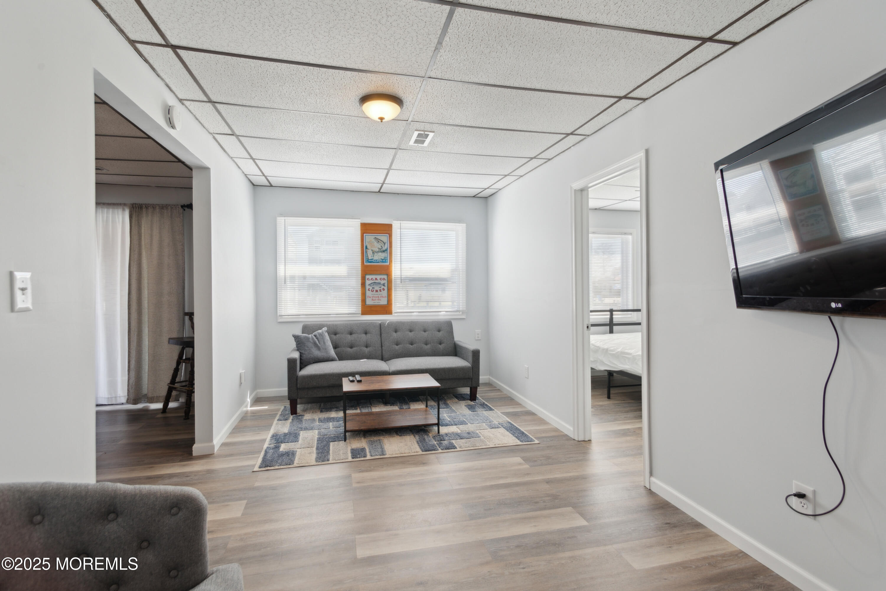 131 South Commodore Drive Little Egg Harbor, NJ 08087 - Photo 8 of 25 a living room with furniture and a flat screen tv