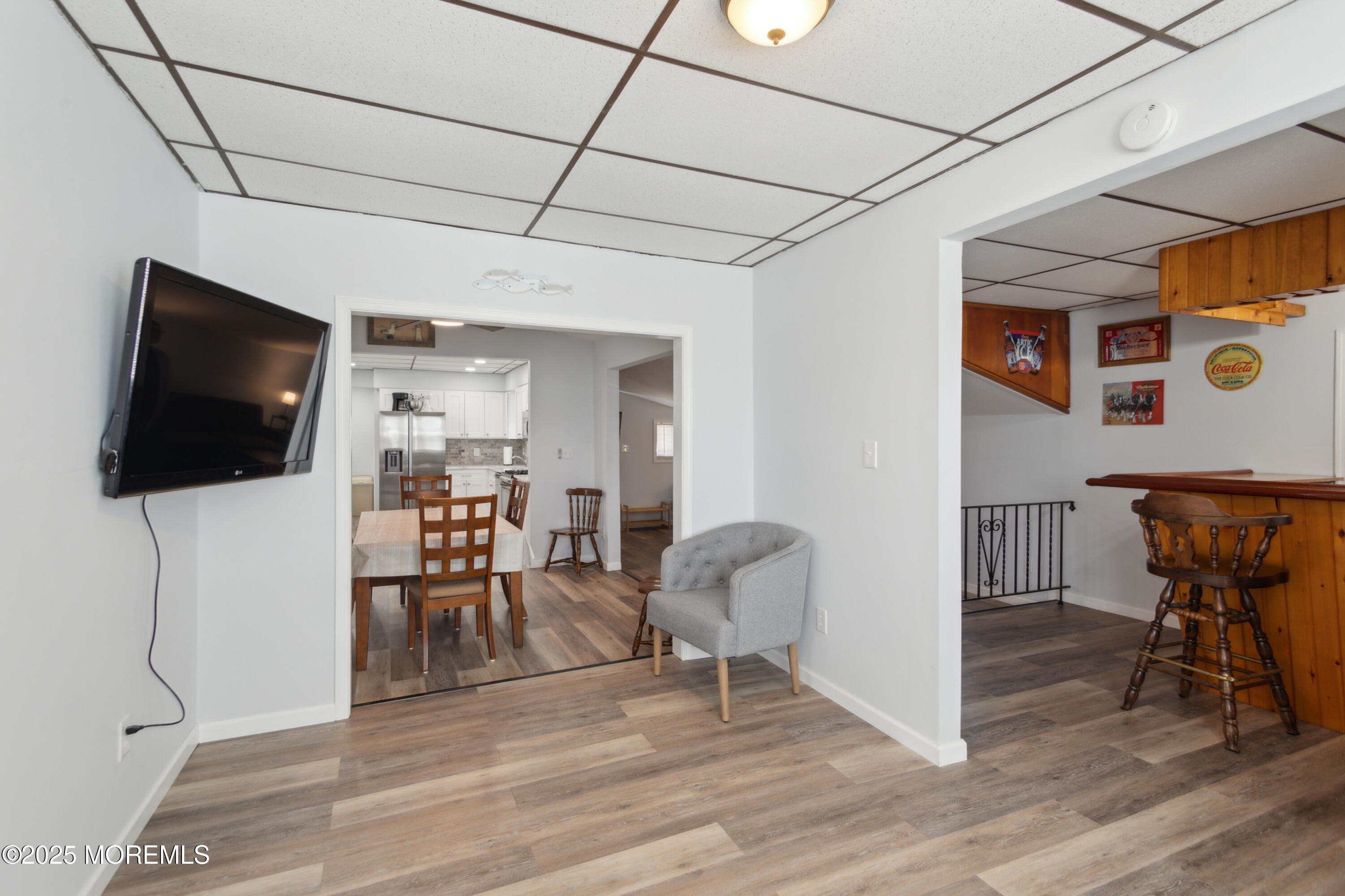 131 South Commodore Drive Little Egg Harbor, NJ 08087 - Photo 9 of 25 a living room with furniture and a flat screen tv