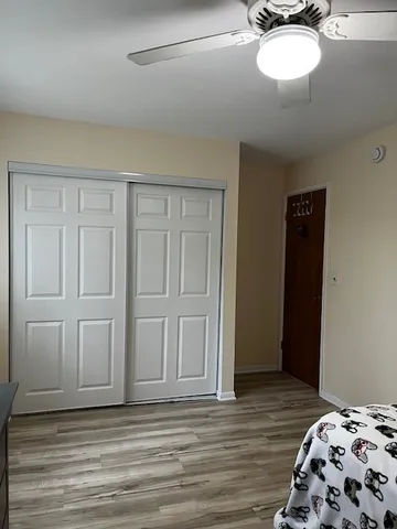 a bedroom with a bed and cabinets