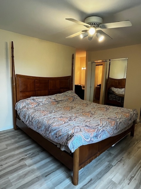 1301 South Finley Road, Unit 414 Lombard, IL 60148 - Photo 15 of 25 a bedroom with a large bed and a chandelier