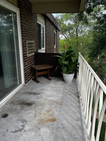 a side of a house with a yard