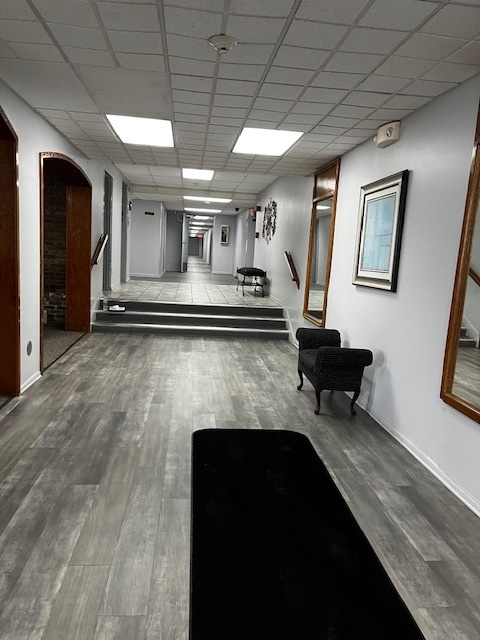 1301 South Finley Road, Unit 414 Lombard, IL 60148 - Photo 2 of 25 a living room with furniture and a fireplace