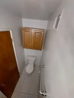 a side of a house with a yard