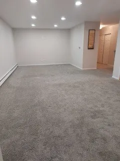 an empty room with window and pillar in it