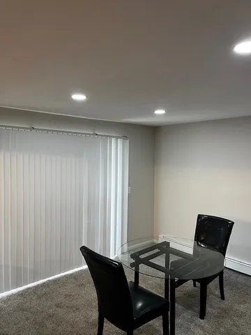 a view of a room with furniture window and wooden floor
