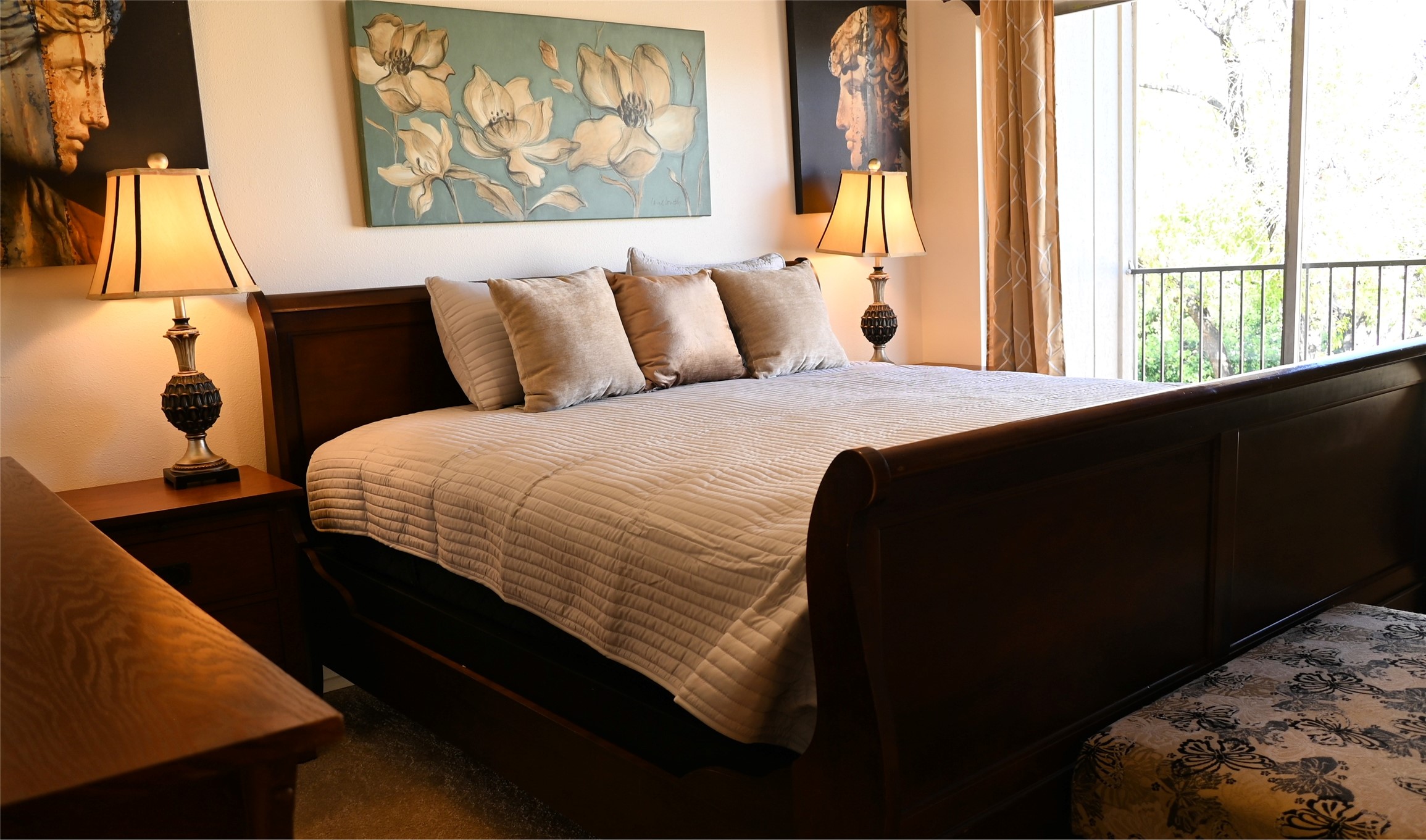 500 East Riverside Drive, Unit 224 Austin, TX 78704 - Photo 11 of 19 A well-appointed sleeping sanctuary features soft lighting and verdant outdoor views.