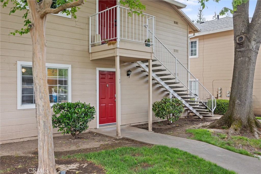 2055 Amanda Way, Unit 29 Chico, CA 95928 - Photo 1 of 19 a front view of a house with a yard and plants