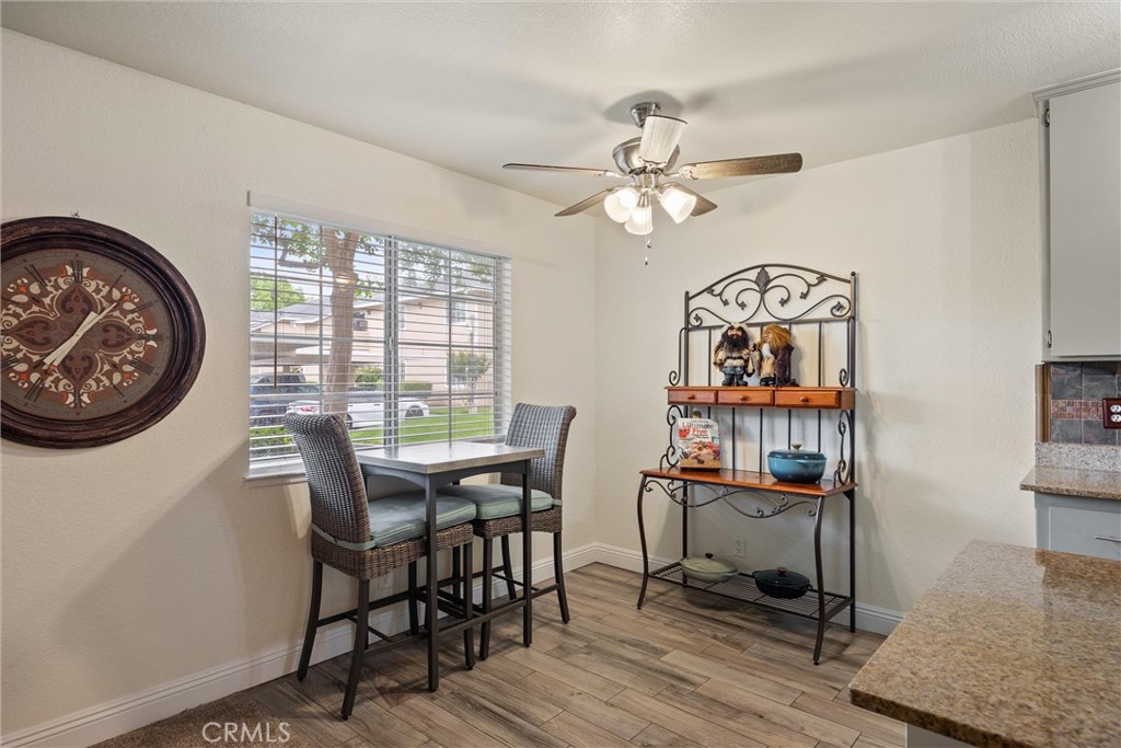 2055 Amanda Way, Unit 29 Chico, CA 95928 - Photo 12 of 19 a view of a dining room with furniture window and wooden floor