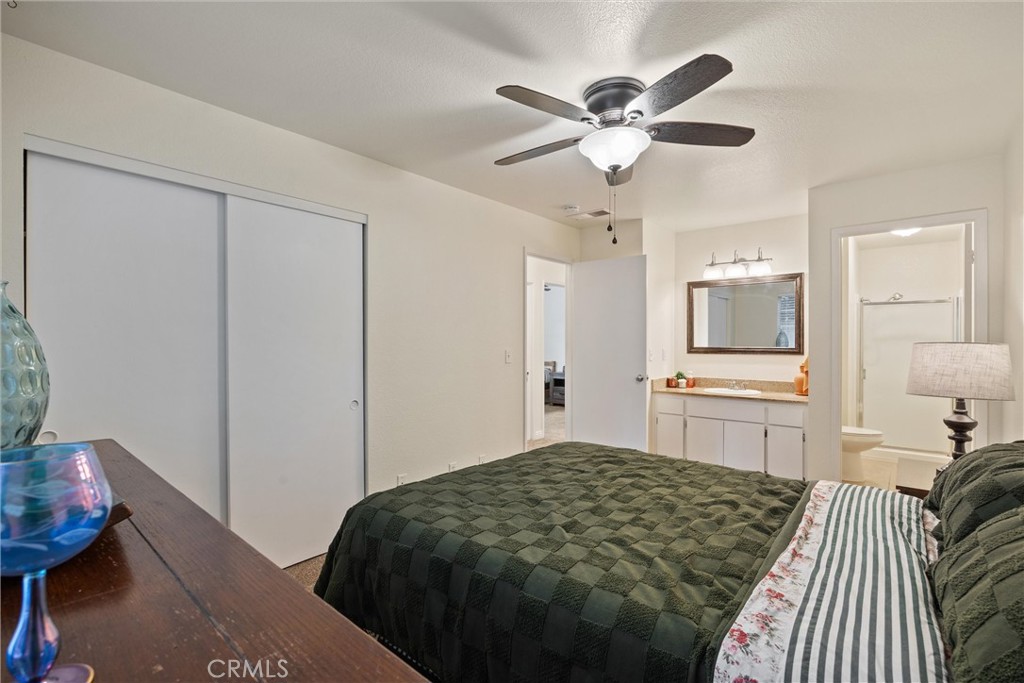 2055 Amanda Way, Unit 29 Chico, CA 95928 - Photo 13 of 19 a bedroom with a bed and a chandelier