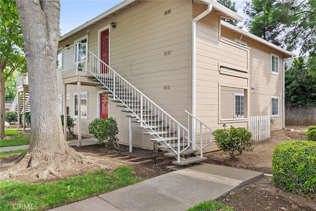 2055 Amanda Way, Unit 29 Chico, CA 95928 - Photo 18 of 19 a view of a house with brick walls plants and large tree
