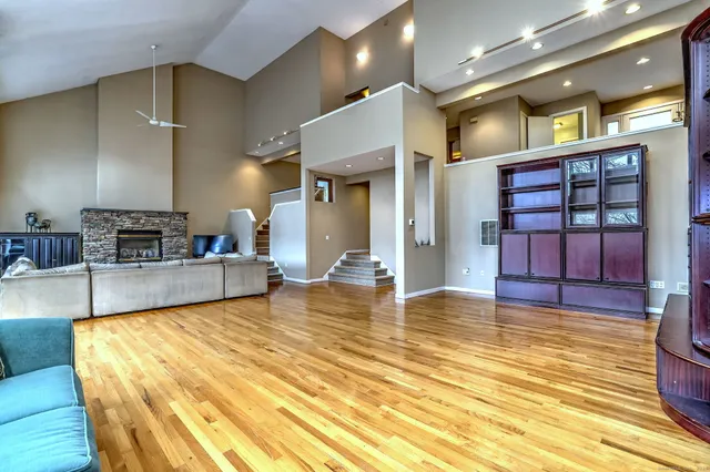 a view of a living room kitchen and a wooden floor