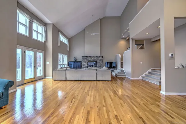 a view of living room with furniture and floor to ceiling windows
