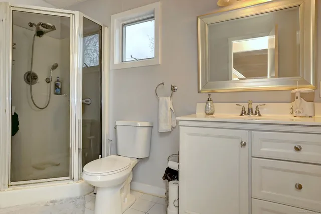 a bathroom with a sink a vanity and a mirror