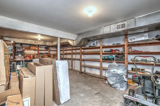 a bathroom with a white sink and a mirror