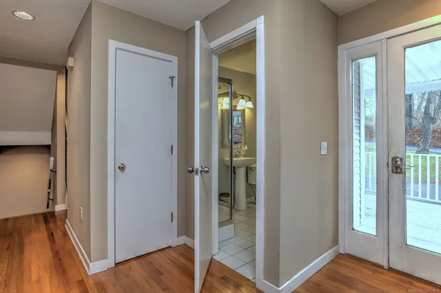 a view of a hallway with furniture and front door
