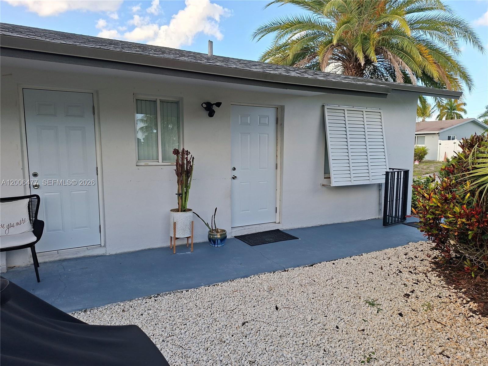 1814 Southwest 97th Terrace, Unit A Miramar, FL 33025 - Photo 2 of 9 a view of a house with a patio
