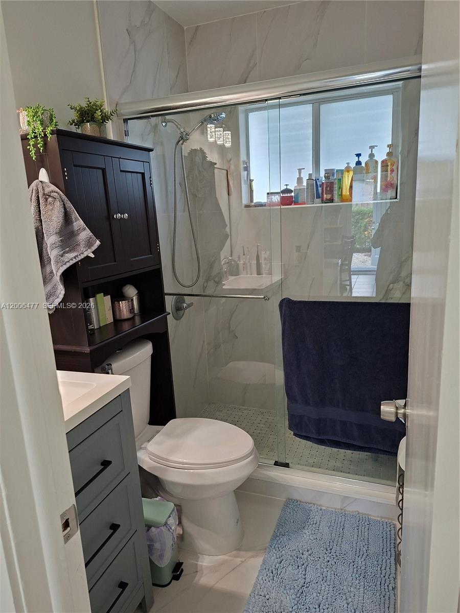 1814 Southwest 97th Terrace, Unit A Miramar, FL 33025 - Photo 5 of 9 a bathroom with a toilet and a shower