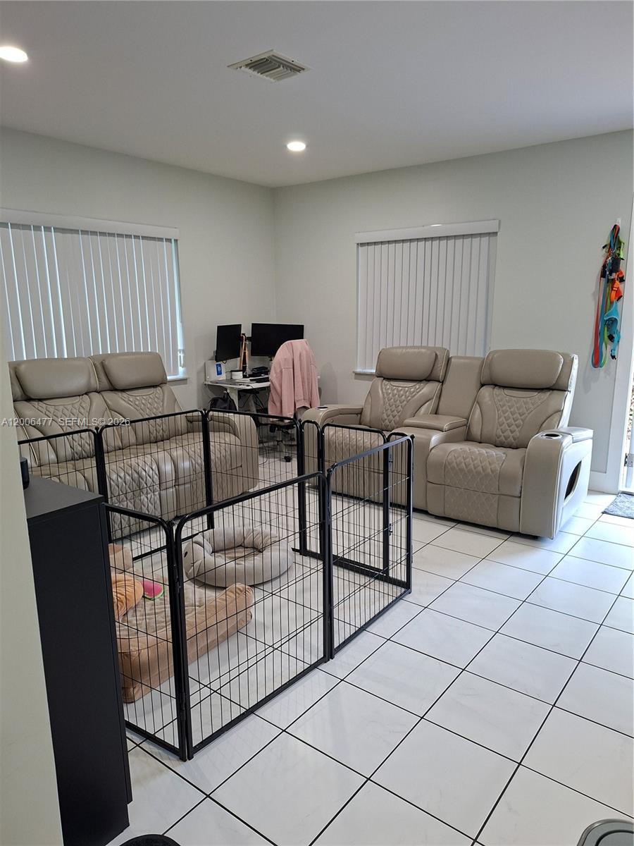 1814 Southwest 97th Terrace, Unit A Miramar, FL 33025 - Photo 8 of 9 a living room with furniture
