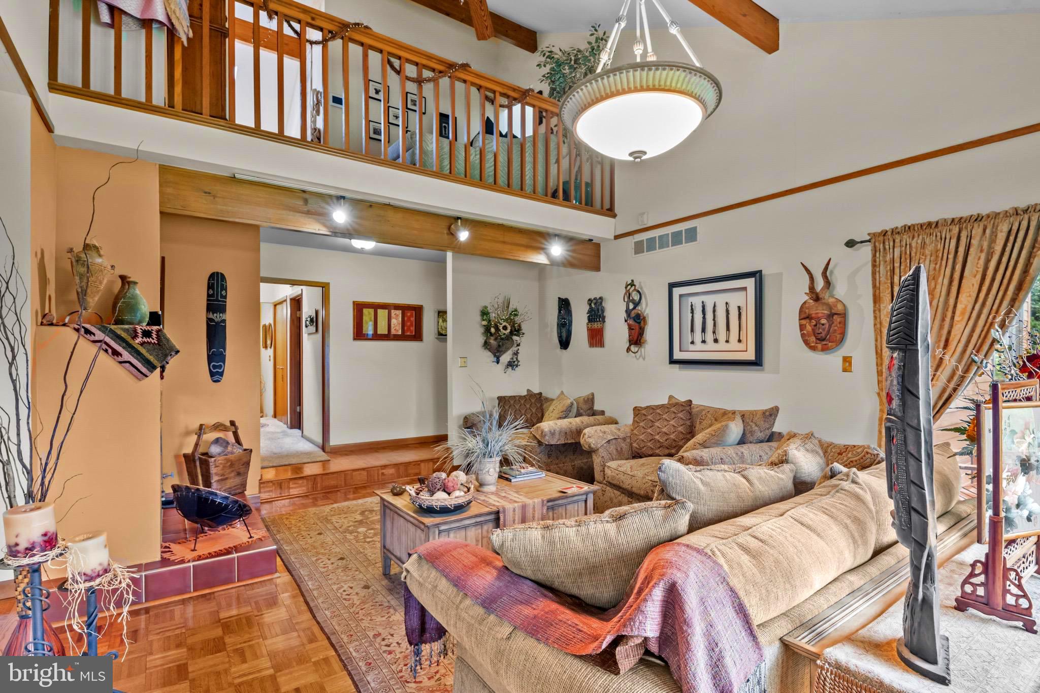 16 Golfview Lane Reading, PA 19606 - Photo 17 of 70 a living room with furniture a rug and a wall painting