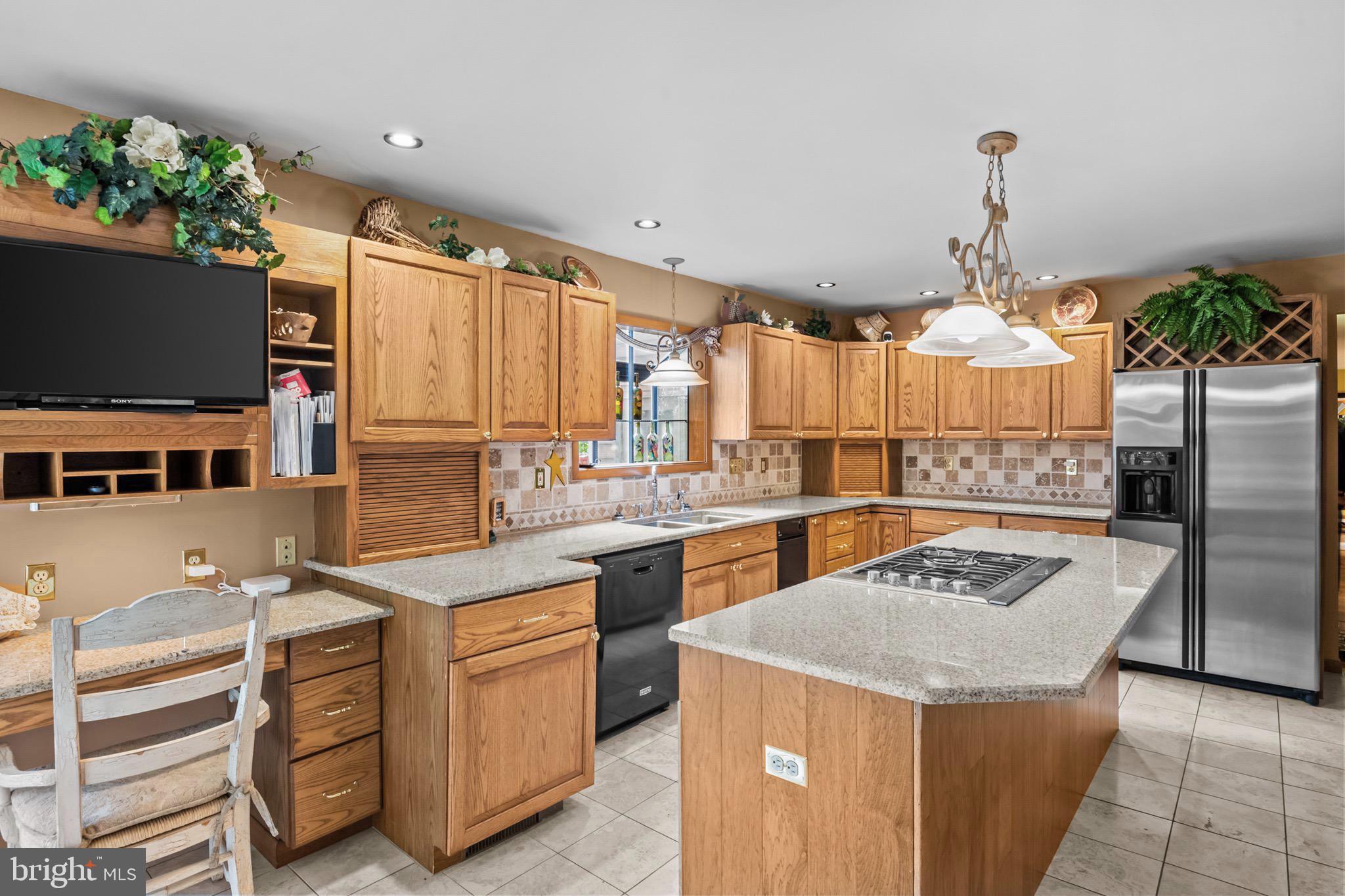 16 Golfview Lane Reading, PA 19606 - Photo 21 of 70 a kitchen with a stove a sink and a refrigerator