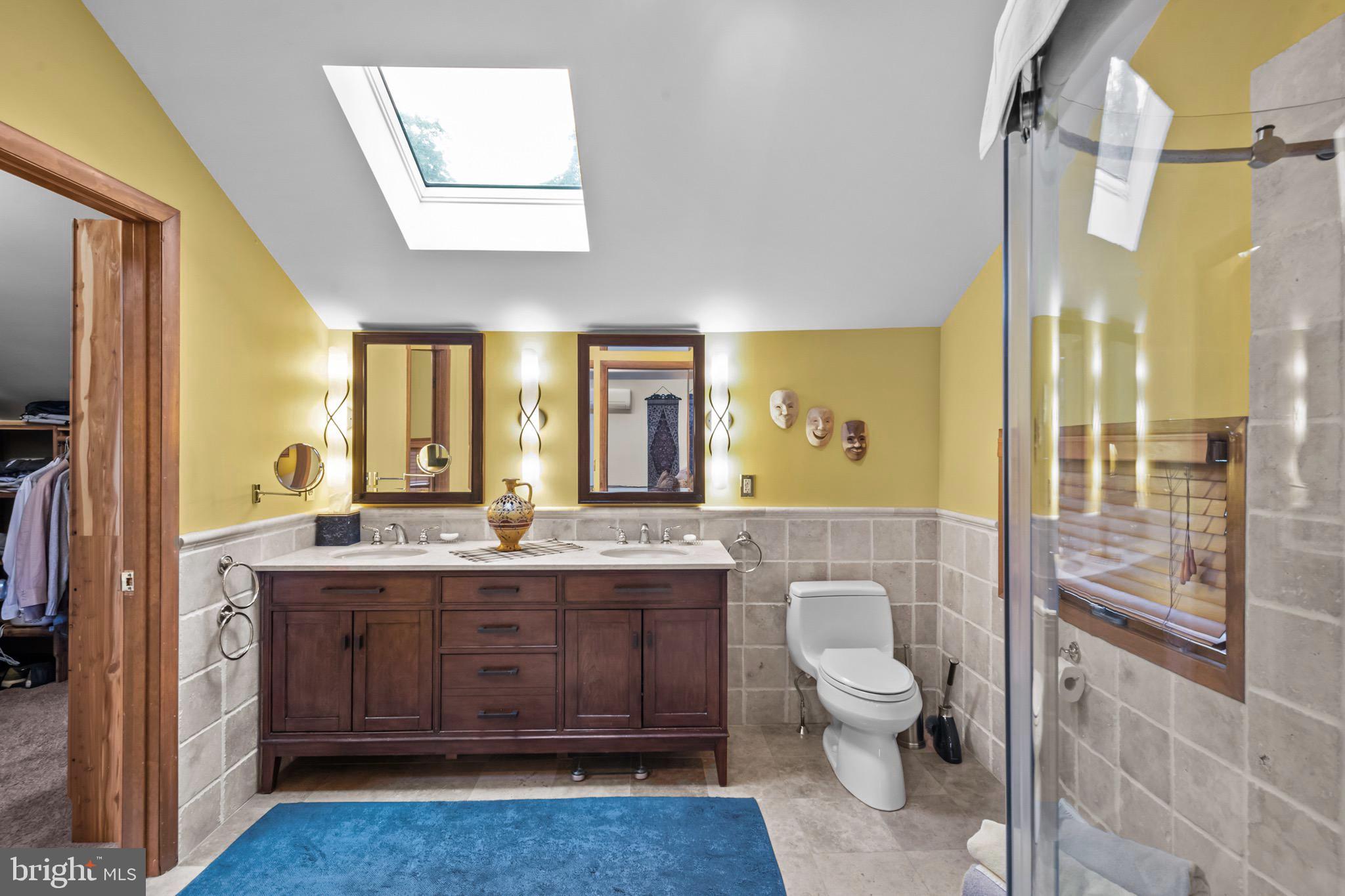 16 Golfview Lane Reading, PA 19606 - Photo 43 of 70 a spacious bathroom with a granite countertop sink a toilet a mirror and shower