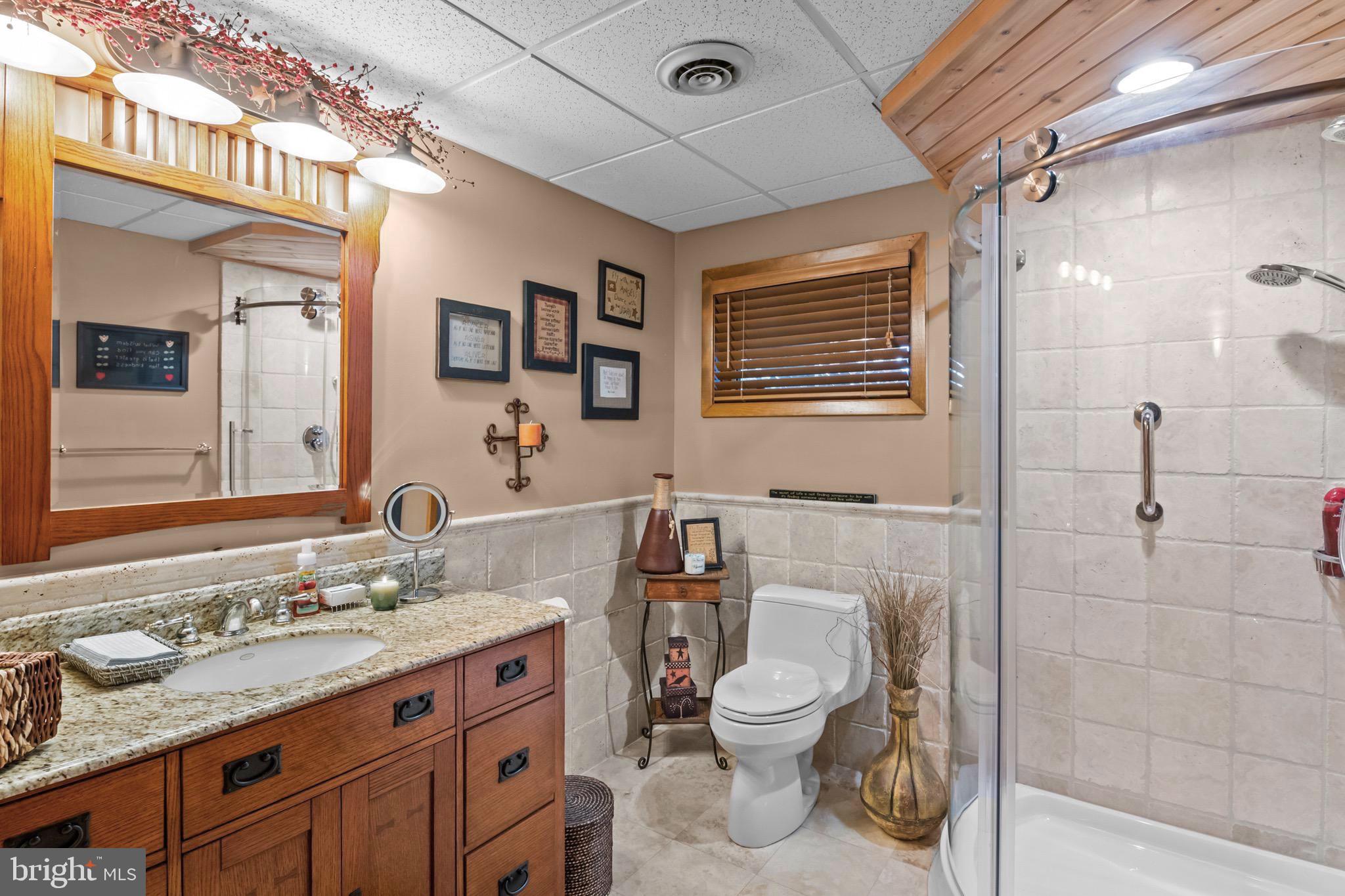 16 Golfview Lane Reading, PA 19606 - Photo 50 of 70 a bathroom with a granite countertop sink toilet and shower
