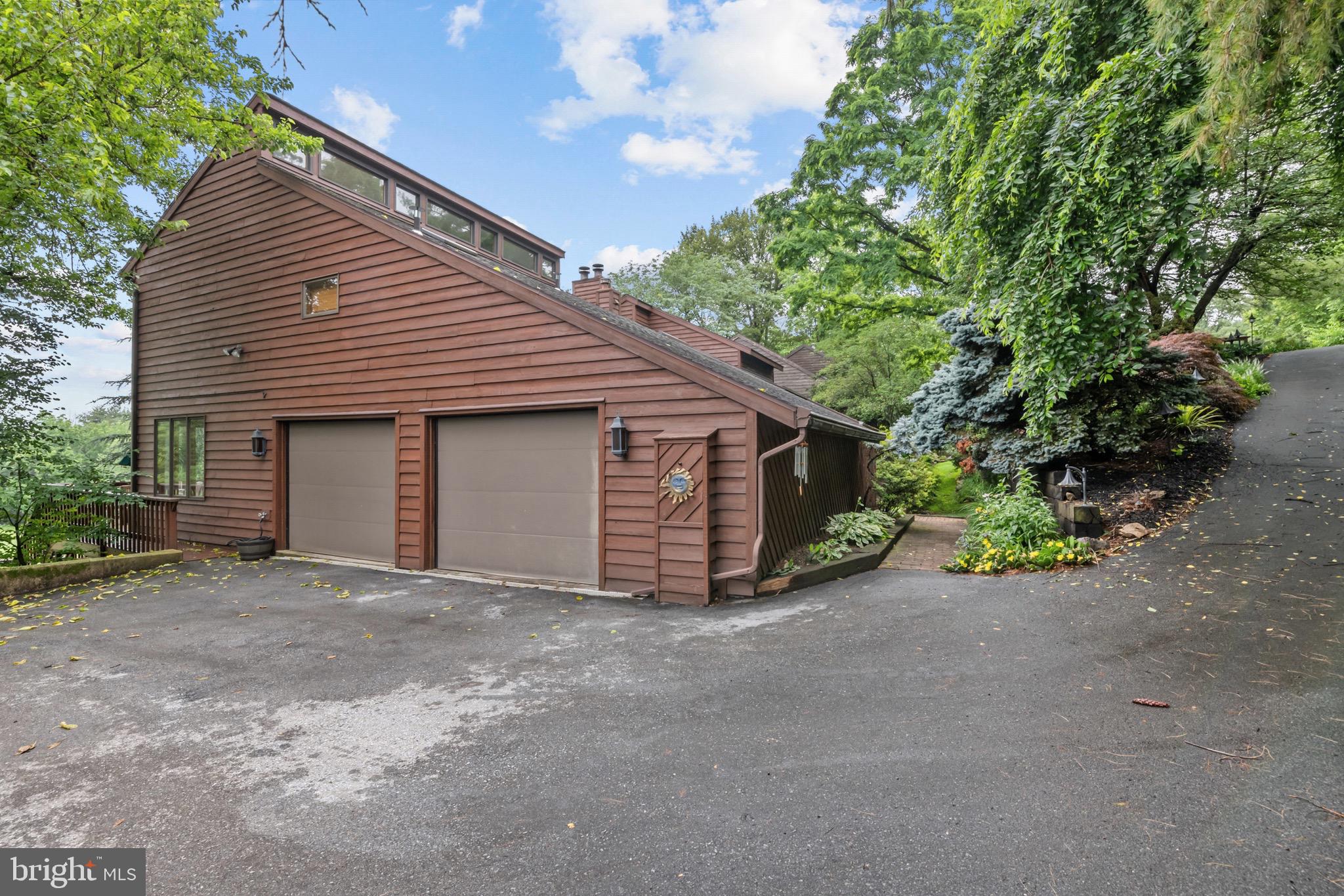 16 Golfview Lane Reading, PA 19606 - Photo 10 of 70 a front view of a house with a yard and garage