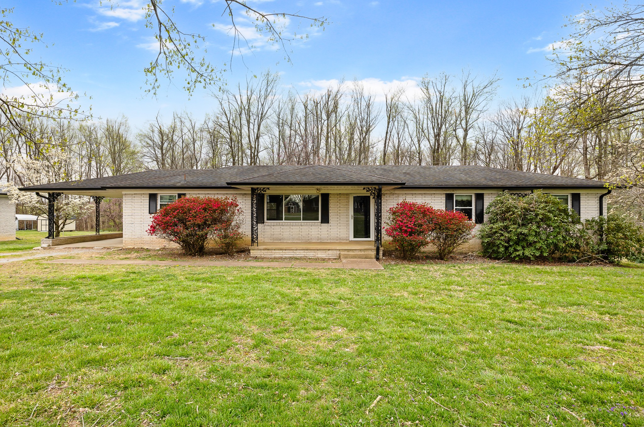 111 Cothron Drive Lafayette, TN 37083 - Photo 1 of 33 a front view of a house with a garden