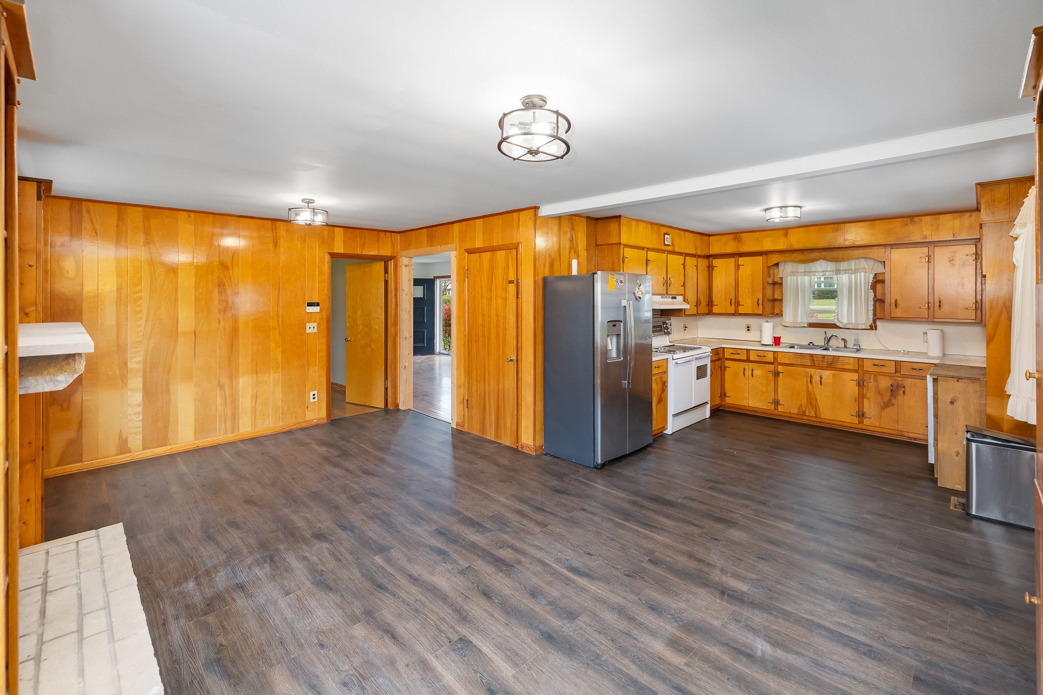 111 Cothron Drive Lafayette, TN 37083 - Photo 14 of 33 a view of a kitchen with a stove wooden floor and a window