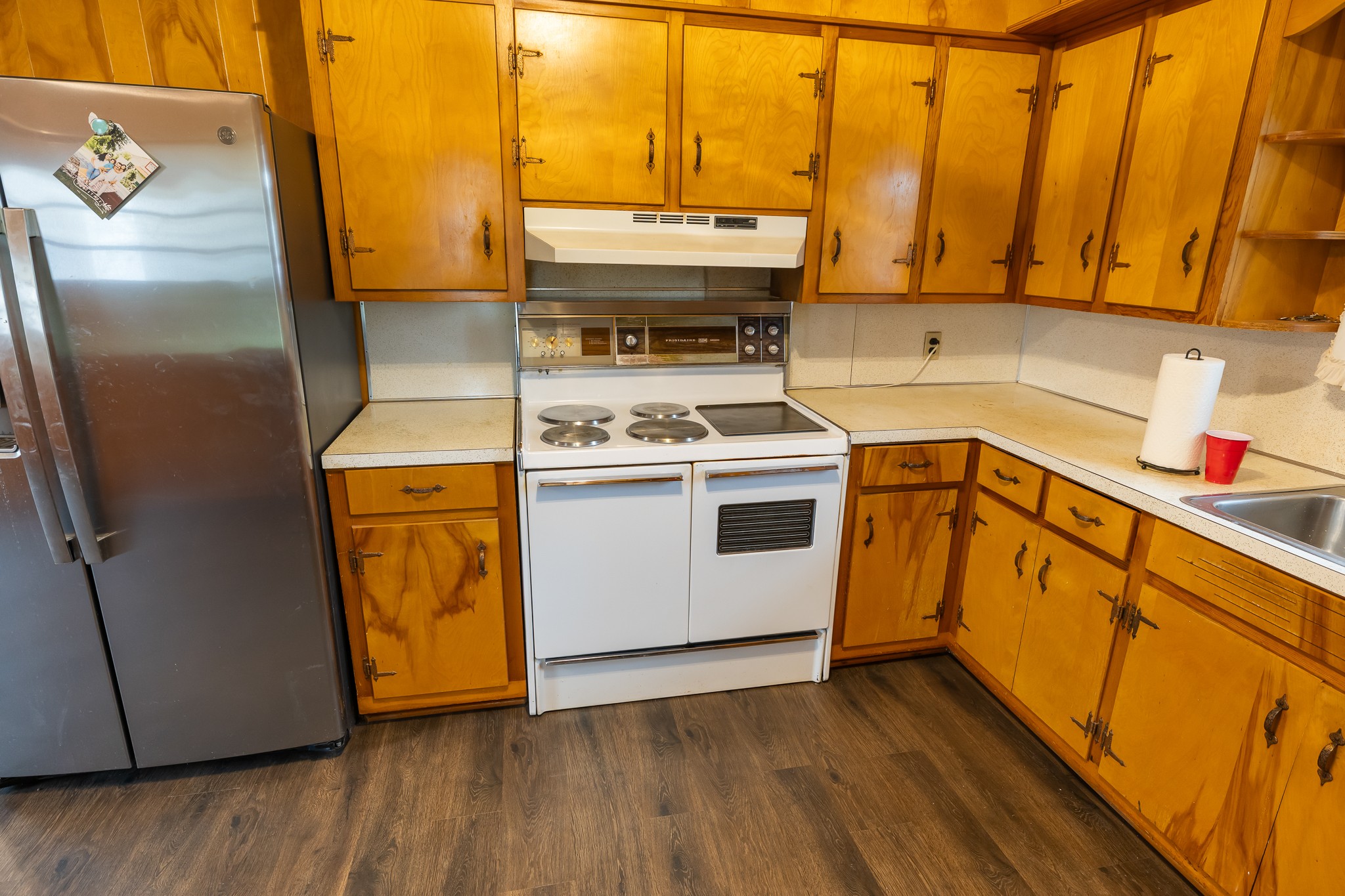 111 Cothron Drive Lafayette, TN 37083 - Photo 16 of 33 a kitchen with a stove a sink and a microwave