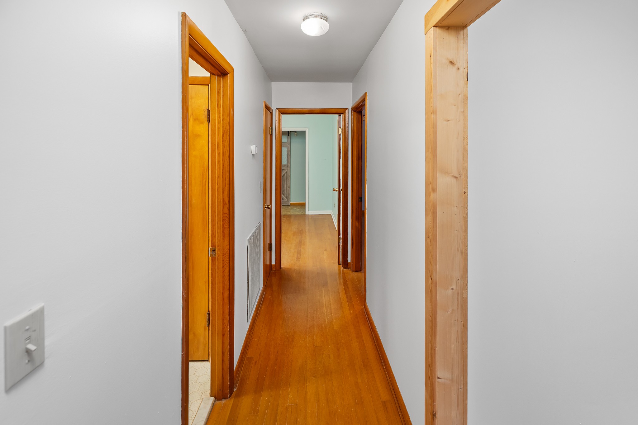111 Cothron Drive Lafayette, TN 37083 - Photo 17 of 33 a view of a hallway with wooden floor and a bathroom